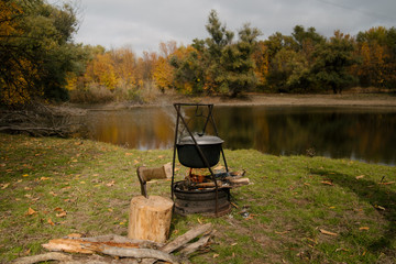 Hiking pot, Bowler in the bonfire. Fish soup boils in cauldron at the stake.
