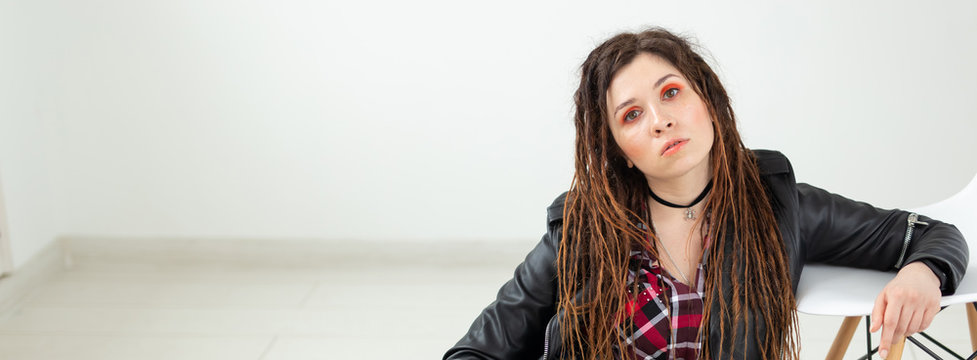 Dreadlocks, hairdresser and style concept - A stylish girl with dreadlocks and in leather jacket and fashionable makeup, copyspace