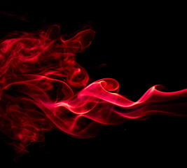 Red smoke on black background