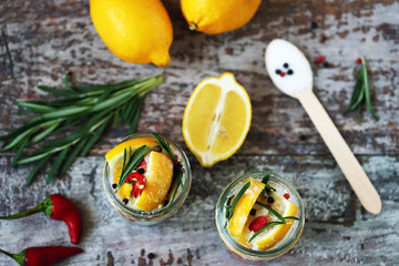 Fermented lemons in jars. Probiotics and fermented foods. Selective focus macro.