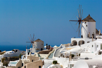 View of white Oia's village in a sunny summer day on Santorini's island, Greece