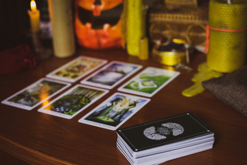  Mystical atmosphere, view of tarot card on the table, esoteric concept, fortune telling and predictions. 