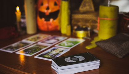  Mystical atmosphere, view of tarot card on the table, esoteric concept, fortune telling and predictions. 
