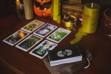  Mystical atmosphere, view of tarot card on the table, esoteric concept, fortune telling and predictions. 