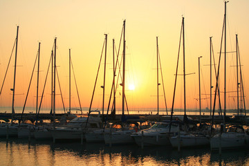 Fototapeta na wymiar Sunset in the marina of la Grande Motte in Herault, a seaside resort of the Languedoc coast and leisure centre near Montpellier in France