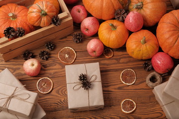 Gift boxes with pumpkins garlands holiday concept.