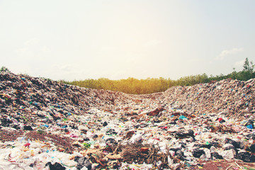 Mountain garbage, large and degraded garbage pile, Pile of stink and toxic residue, waste plastic bottles and other types of plastic waste site in trash dump or landfill. Pollution concept.