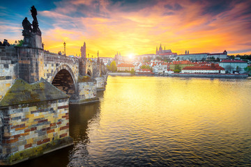 Medieval pedestrian stone Charles bridge at sunset, Prague, Czech Republic