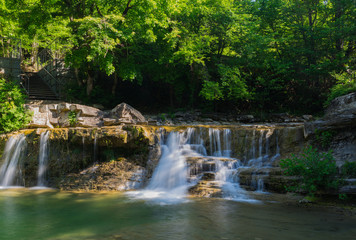 Fototapeta na wymiar Plesetskie waterfalls Gelendzhik. Gelendzhik. Krasnodar region. Russia. 05.2018