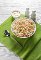 macaroni salad in a white bowl, top view
