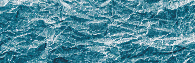Background blue crumpled paper. Panorama.