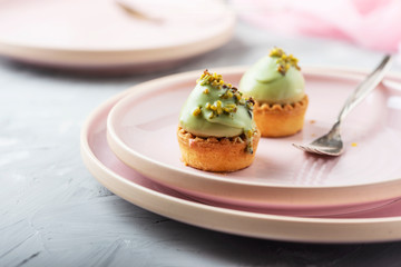 Small tasty cakes with pistachio mousse