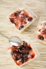 Delicious homemade cheesecake with strawberries on caramel colored background