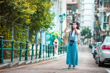 Fototapeta premium Asian women with camera Traveling in Macau.