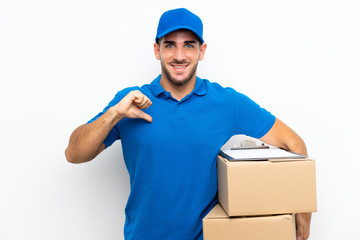 Fototapeta na wymiar Delivery man over isolated white background proud and self-satisfied