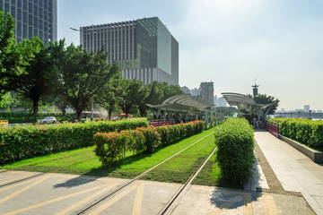 Tram stop and grassed track at downtown of Guangzhou, China