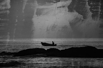 small boat and man silhouette on sunrise, black and white grunge wallpaper