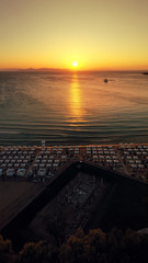 Aerial drone photo of iconic Astir or Asteras celebrity beach featuring ancient Apollo Zoster...