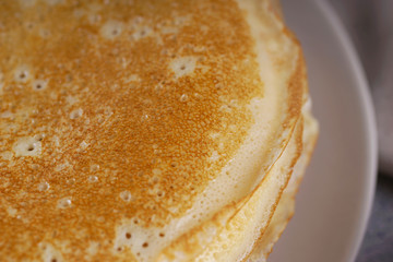 Breakfast with pancakes on a textured background