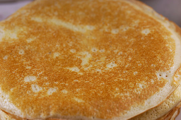 Breakfast with pancakes on a textured background