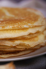 Breakfast with pancakes on a textured background