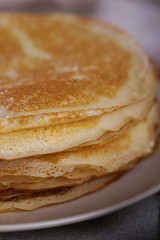 Breakfast with pancakes on a textured background