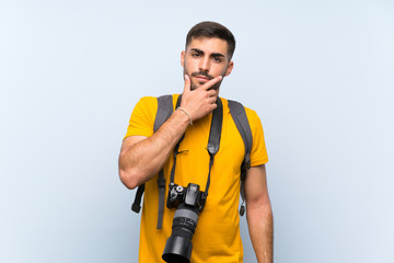 Young photographer man thinking an idea