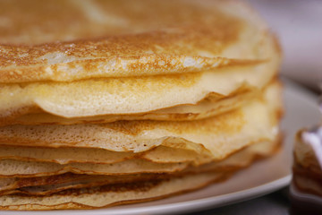 Breakfast with pancakes on a textured background
