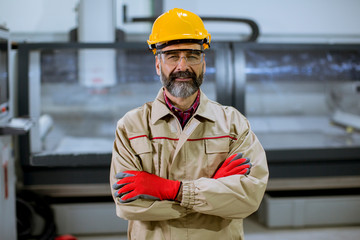 Portrait of senior engineer in factory