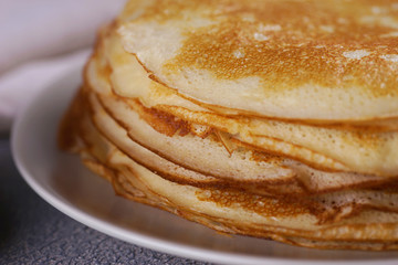 Breakfast with pancakes on a textured background
