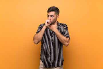 Handsome man with beard over isolated background is suffering with cough and feeling bad