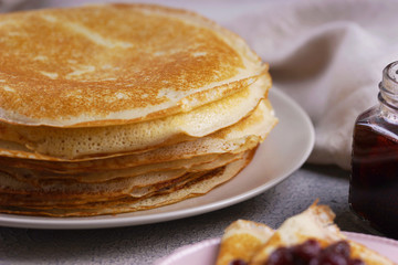 Breakfast with pancakes on a textured background