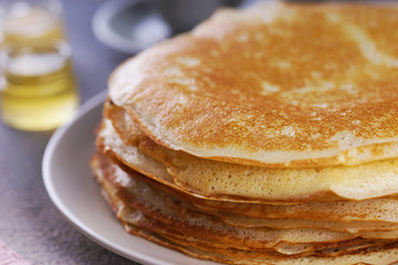 Breakfast with pancakes on a textured background
