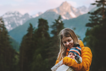 Mother hiking with baby travel family vacations in mountains healthy lifestyle outdoor parenthood maternity summer trip