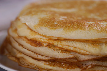 Breakfast with pancakes on a textured background