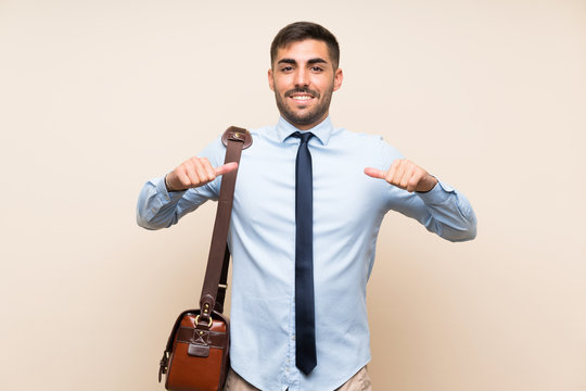 Young business with beard over isolated background proud and self-satisfied