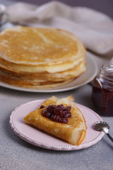 Breakfast with pancakes on a textured background