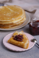 Breakfast with pancakes on a textured background