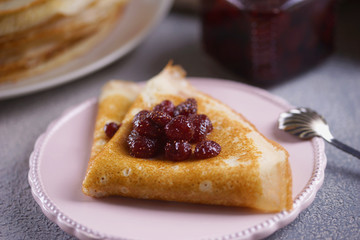 Breakfast with pancakes on a textured background