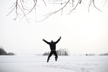 A man on a walk. Winter landscape. Tourist in winter journey.