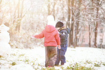 Children in winter park play