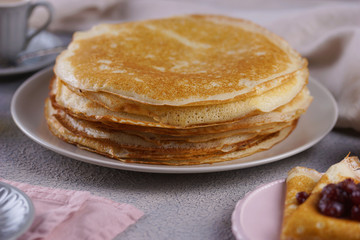 Breakfast with pancakes on a textured background