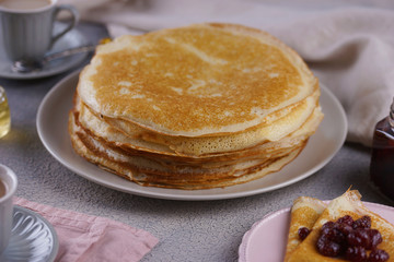 Breakfast with pancakes on a textured background