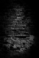 Black brick walls background and texture. The texture of the brick is black. Background of empty...