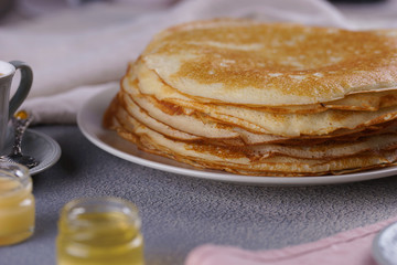 Breakfast with pancakes on a textured background
