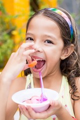 little girl blowing soap bubbles