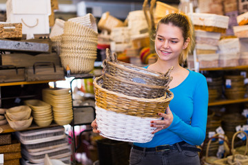 woman consumer holding wicker basket