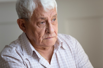 Senior man feels sad and lonely close up portrait