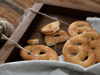 Sugar pretzels on a wooden tray.