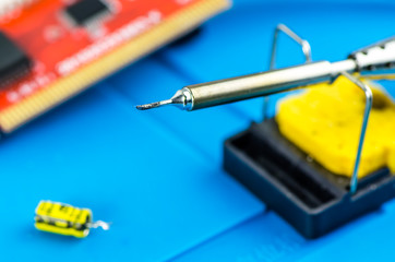 The electrician's workplace. Schemes, soldering iron. Electronics